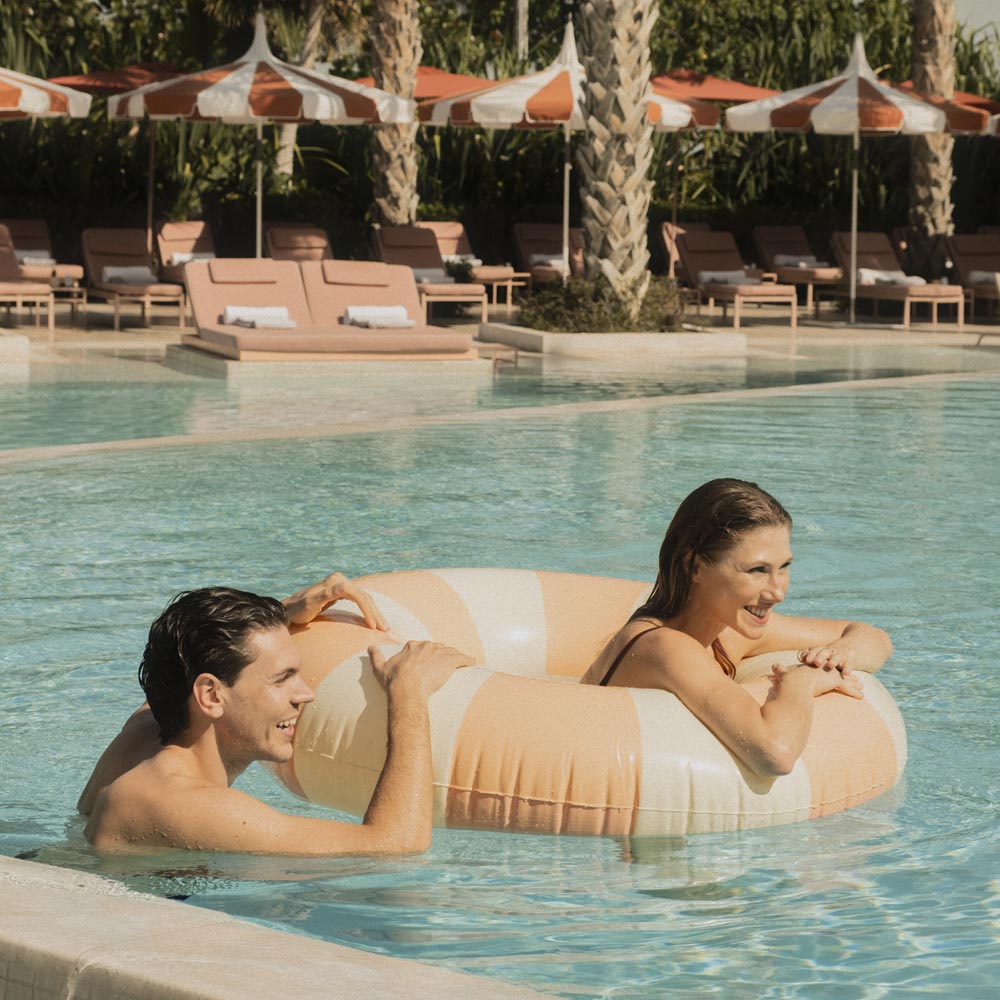 A couple enjoying the pool.